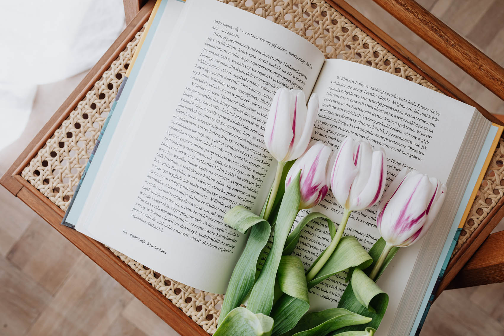 open book with tulips sprawled across the right-side page
